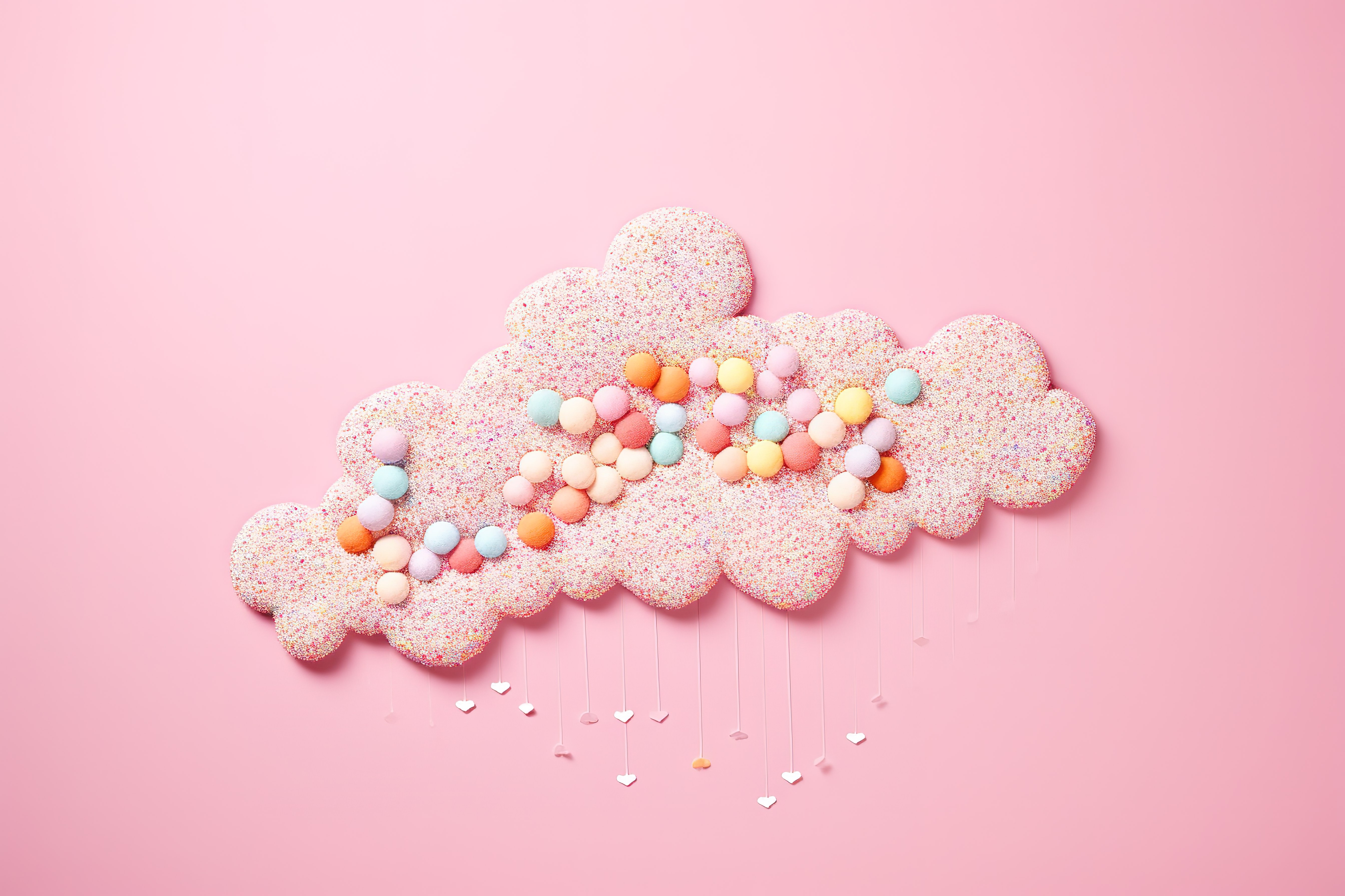 粉红色背景中由糖果棉花糖制成的云图片