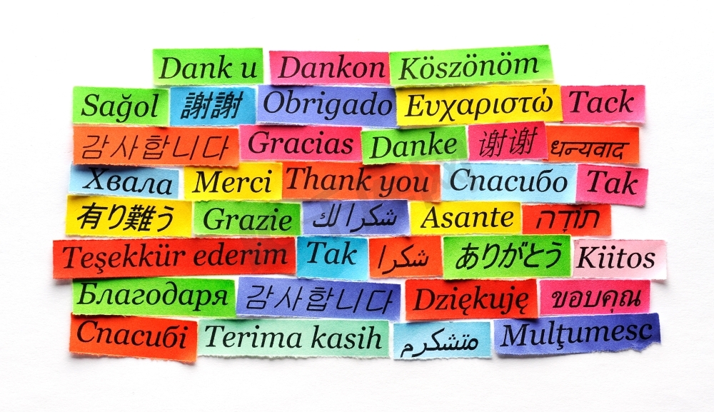 谢谢Word Cloud打印在不同语言的彩色纸上图片