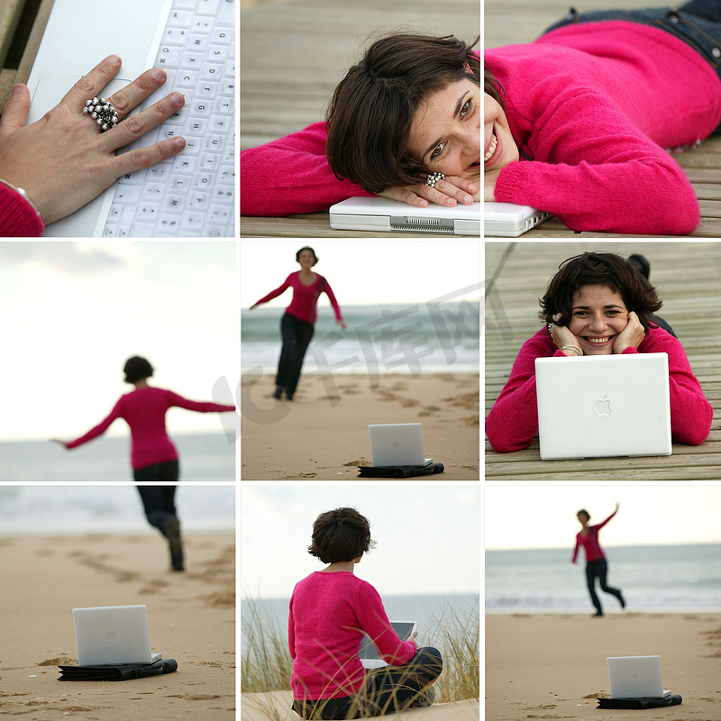 穿着紫红色套头衫的黑发女郎在海滩工作图片
