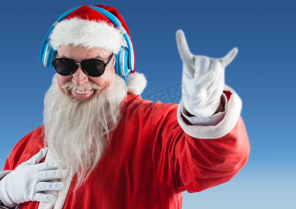 圣诞老人戴着耳机听音乐并打手势图片