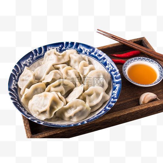 盘子里水饺筷子醋图片