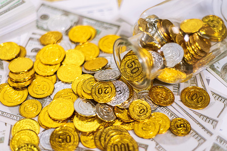 财经金融摄影照片_倒出的金币大量金币银币摄影图