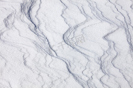 雪地摄影照片_风吹雪层纹理