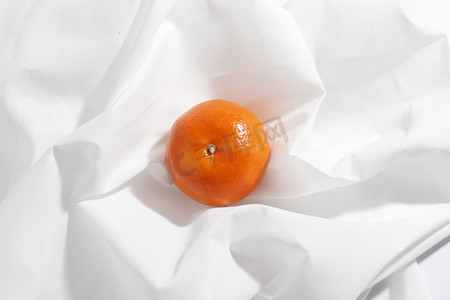 白布摄影照片_橘子水果摄影图