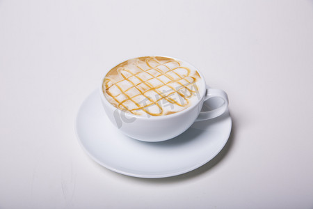 陶瓷摄影照片_马克杯美味拉花咖啡饮品摄影图  