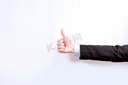 商务男士西装男士大拇哥胜利手势摄影图