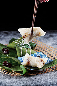 端午节粽子粽叶摄影图