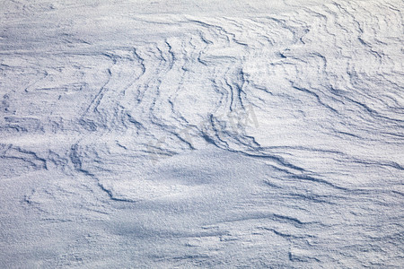 风吹雪层纹理摄影图
