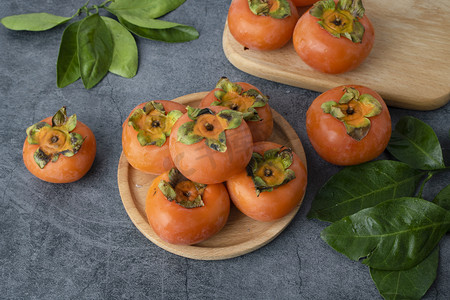 秋季丰收的果实柿子美食摄影图
