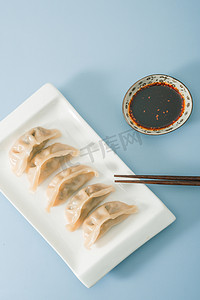 美食水饺筷子摄影图