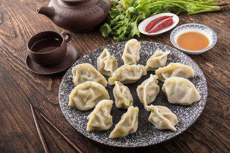 北方水饺摄影照片_美食茶具醋辣椒水饺