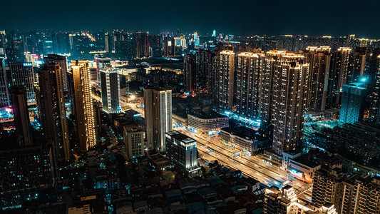 武汉城市建筑群夜晚建筑群写字楼 居民楼 车流办公楼摄影图配图