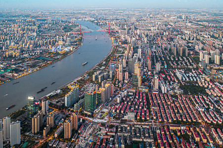 儿童影楼相册摄影照片_城市夕阳河城市航拍摄影图配图