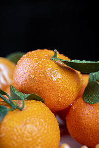 水果橘子砂糖橘桌子堆叠摄影图配图
