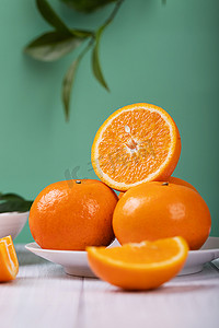 生鲜字体摄影照片_新鲜成熟的沃柑柑橘蜜桔摄影图配图