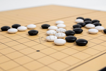 独唱比赛摄影照片_围棋室内五子棋局静物摆拍摄影图配图