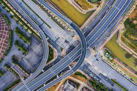 城市马路摄影照片_城市中午立交公路航拍摄影图配图