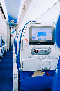 出行方式白天机舱里的座椅飞机内部空镜特写摄影图配图