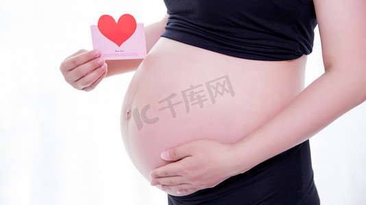 妈妈摄影照片_妇女怀孕孕妇孕妈咪三胎摄影图配图
