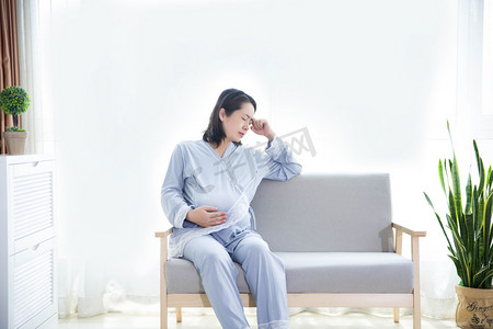 孕吐孕妈人像三胎难受的孕妇摄影图配图