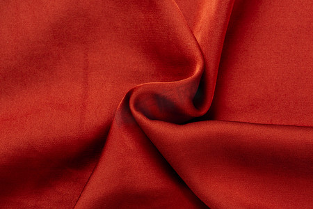 纺织品布料纹理褶皱绸缎光泽酒红色摄影图配图