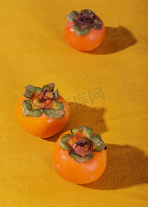 柿子果实摄影照片_食物夏天柿子影棚摄影摄影图配图