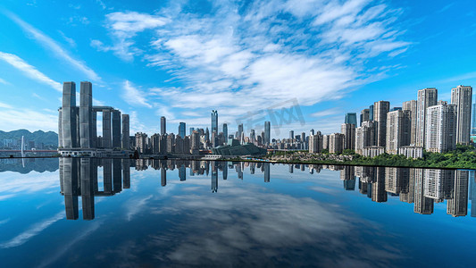 商务简洁背景板摄影照片_重庆市中心建筑城市倒影蓝天白云