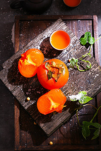 水果秋季柿子红柿创意摄影图配图