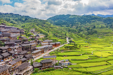 苗寨摄影照片_4A景区中午西江千户苗寨田园航拍摄影图配图