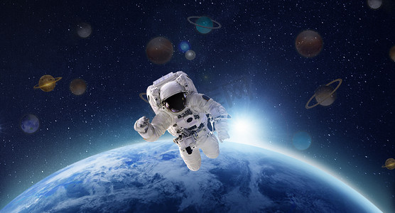 宇航员遨游太空白天宇航员太空遨游摄影图配图