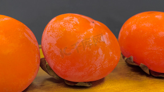 柿子果实摄影照片_实拍水果柿子红色柿子果实