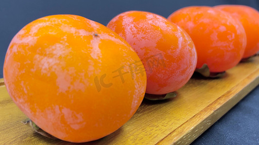 柿子果实摄影照片_柿子红色柿子果实