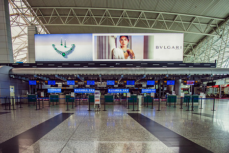 广州广州机场飞机场候客厅购票工作台摄影图配图