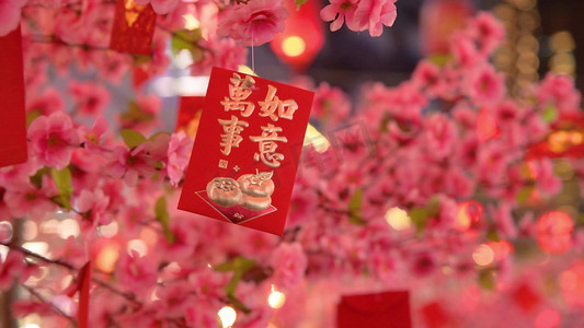 元宵节摄影照片_粉色许愿树上的红包