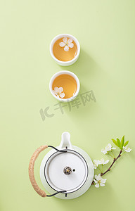 茶叶背景摄影照片_茶文艺白天茶杯和茶壶室内无摄影图配图