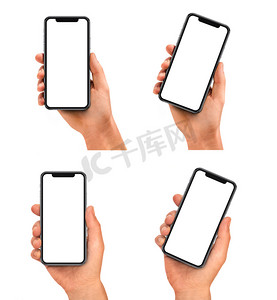 白色背景摄影照片_样机手持黑色智能手机与空白屏幕白色背景隔离