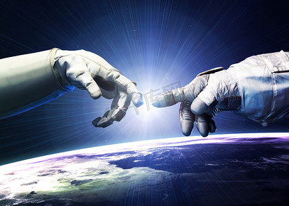 米开朗基罗神的触摸。人类的手在太空中与手指接触的近距离接触。美国航天局提供的这一图像的要素