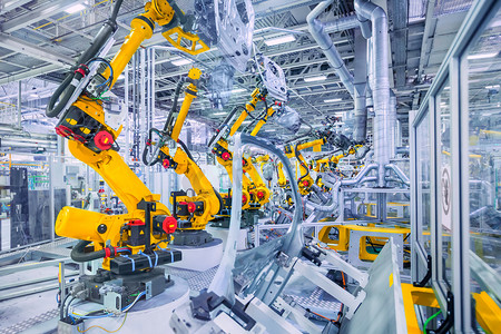 ai金属色板摄影照片_机器人在汽车制造厂