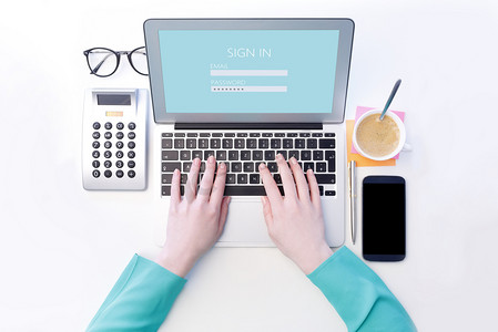 Woman Typing on laptop's keyboard