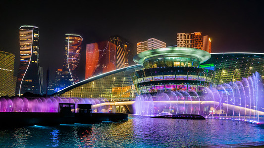 城市夜景杭州大剧院喷泉灯光秀摄影图配图