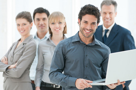 Business man holding a modern laptop