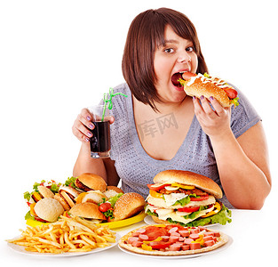 hamburguer摄影照片_吃快餐的妇女.