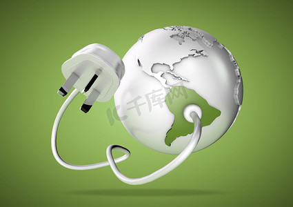 Electrical cable and plug connects power to South America on a world globe. Concept for how Brazil and Argentina consume electricity and energy and how they need to use renewable, green, alternative energy solutions like solar & wind turbine energy.