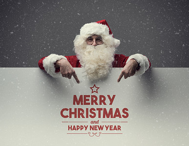 圣诞节圣诞节海报摄影照片_圣诞老人指着圣诞节的祝福
