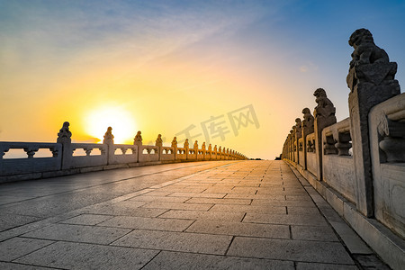 Bridgehead Beast of the Seventeen-hole Bridge in the Summer Palace, Beijing, China. Sunset at the Summer Palace in Beijing, China