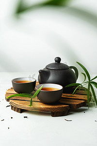 白色茶具摄影照片_亚洲食物背景，配有茶具、茶杯和茶壶，并配有白色石头背景的文字空间.