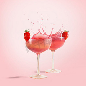 粉红色鸡尾酒飞溅在香槟杯与草莓在粉红色背景与阳光。流动的液体。很棒的饮料。前视图。