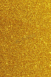 闪亮的金色波克闪闪发光的抽象背景，圣诞新年晚会庆祝概念。闪亮的金色灯光背景