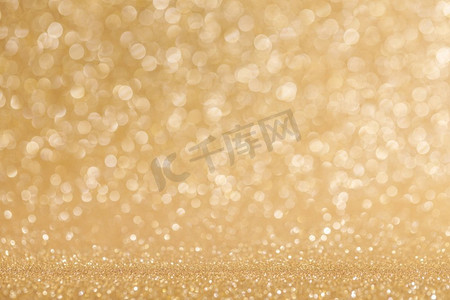 闪亮的金bokeh闪光的光抽象背景，圣诞节新年豪华聚会庆祝概念。闪亮的金色灯光背景