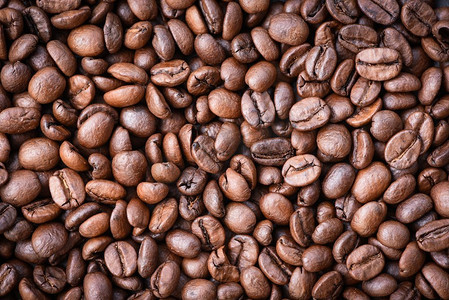 咖啡豆纹理摄影照片_烤咖啡豆纹理背景/关闭咖啡豆顶视图 